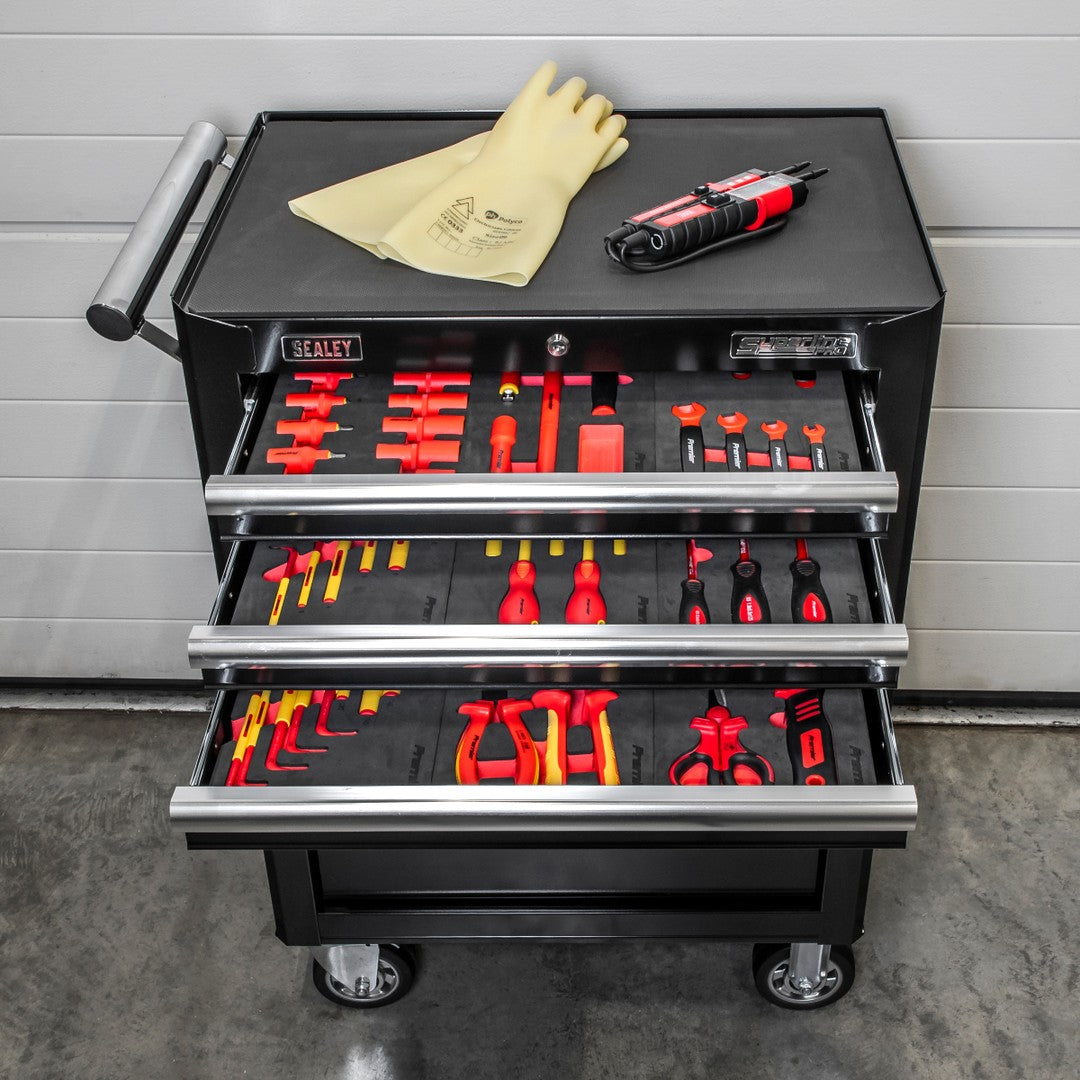 Black Sealey roller cabinet with three open drawers of insulated VDE tools in foam trays