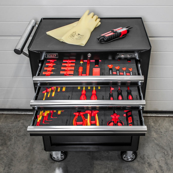 Black Sealey roller cabinet with three open drawers of insulated VDE tools in foam trays